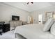 Comfortable main bedroom featuring a cozy chair, a dresser and a television for relaxing evenings at 530 Dovefield Dr, Indian Trail, NC 28079