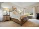 Inviting bedroom with a comfortable bed, stylish nightstands, and bright window at 530 Dovefield Dr, Indian Trail, NC 28079