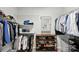 Walk-in closet featuring ample storage with shelving, clothing racks and a shoe rack at 530 Dovefield Dr, Indian Trail, NC 28079