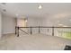 Large bonus room with neutral carpet, open to floor below at 5684 Garrow Glen Rd # 96, Charlotte, NC 28278