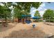 Community playground featuring colorful play equipment and a wood chip ground cover at 5684 Garrow Glen Rd # 96, Charlotte, NC 28278