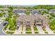Street view showcasing townhome exteriors, attached garages, and landscaped yards at 5684 Garrow Glen Rd # 96, Charlotte, NC 28278