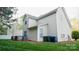 A spacious backyard is lined with mulch and landscaping, and has a gray wood back deck at 5808 Mcdowell Run Dr, Huntersville, NC 28078