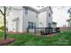 A well-maintained backyard features a gray wood deck, perfect for outdoor entertaining at 5808 Mcdowell Run Dr, Huntersville, NC 28078