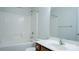 Clean bathroom with tiled shower, vanity, and a mirrored wall at 5808 Mcdowell Run Dr, Huntersville, NC 28078