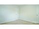 Bright, carpeted bedroom featuring a door and neutral walls at 5808 Mcdowell Run Dr, Huntersville, NC 28078