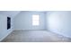 Expansive bedroom features a window and a chalkboard to inspire creativity at 5808 Mcdowell Run Dr, Huntersville, NC 28078