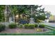 Charming community entrance sign with landscaping and stone accents at 5808 Mcdowell Run Dr, Huntersville, NC 28078