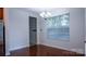 Bright dining area with hardwood flooring, view of the backyard, and neutral walls at 5808 Mcdowell Run Dr, Huntersville, NC 28078