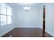 Bright dining room with hardwood floors and a modern chandelier at 5808 Mcdowell Run Dr, Huntersville, NC 28078