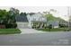 A beautifully landscaped two-story home with a two-car garage and manicured lawn at 5808 Mcdowell Run Dr, Huntersville, NC 28078