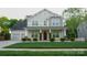 Charming two-story home with a well-manicured lawn and inviting front porch at 5808 Mcdowell Run Dr, Huntersville, NC 28078