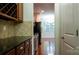 Transitional kitchen featuring stainless steel appliances, granite countertops, and wood cabinetry at 5808 Mcdowell Run Dr, Huntersville, NC 28078