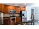 Modern kitchen with stainless appliances and granite countertops at 5808 Mcdowell Run Dr, Huntersville, NC 28078