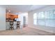 Open floor plan showcasing the kitchen and living room combination with natural light at 5808 Mcdowell Run Dr, Huntersville, NC 28078