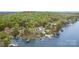 Stunning aerial view features lakefront homes with private docks and lush green surroundings at 602 Shoreline Rd # 144, New London, NC 28127