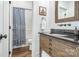 Well-appointed bathroom with a shower and a rustic wooden vanity at 602 Shoreline Rd # 144, New London, NC 28127