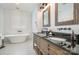 Elegant bathroom with a soaking tub, tile floors, and wooden vanity at 602 Shoreline Rd # 144, New London, NC 28127