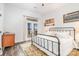 Bedroom with a metal frame bed, hardwood floors, and french doors to the porch at 602 Shoreline Rd # 144, New London, NC 28127