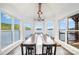 Stunning dining room featuring lake views, modern lighting, and large dining table with seating at 602 Shoreline Rd # 144, New London, NC 28127