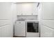 Bright laundry room with a Maytag washer and dryer, and white cabinets at 602 Shoreline Rd # 144, New London, NC 28127