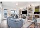 Spacious living room featuring built-in shelving and lake views at 602 Shoreline Rd # 144, New London, NC 28127