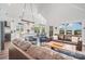 Open-concept living area with modern decor, lots of natural light, and views of the lake at 602 Shoreline Rd # 144, New London, NC 28127