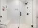 Walk-in shower featuring a tiled wall and glass door at 602 Shoreline Rd # 144, New London, NC 28127