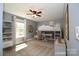 Bedroom showing neutral carpet, ceiling fan, natural light from the window, and nicely decorated with a bunk bed at 6519 Pargo Rd, Charlotte, NC 28216