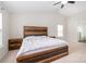Spacious bedroom featuring a vaulted ceiling, ceiling fan, and a beautifully crafted wood bed frame and matching furniture at 6618 Latherton Ln, Charlotte, NC 28278