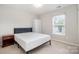 Comfortable bedroom featuring natural light, and a wardrobe closet, perfect for creating a personalized and relaxing space at 6618 Latherton Ln, Charlotte, NC 28278