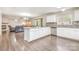 Spacious open-concept kitchen flows into the living room, enhancing natural light and connectivity at 6618 Latherton Ln, Charlotte, NC 28278