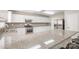 Open concept kitchen features granite countertops, stainless steel appliances, and ample storage space at 6618 Latherton Ln, Charlotte, NC 28278