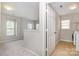 Open landing space with a view to a laundry room, abundant natural light at 6618 Latherton Ln, Charlotte, NC 28278