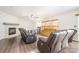 Cozy living room features a fireplace, ceiling fan, and comfortable seating arrangements at 6618 Latherton Ln, Charlotte, NC 28278