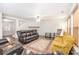 Inviting living room with fireplace, ceiling fan, wood floors and traditional rug at 6618 Latherton Ln, Charlotte, NC 28278
