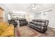 Open living room flows to the kitchen with wood floors and an accent wall at 6618 Latherton Ln, Charlotte, NC 28278