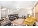 Inviting living room with fireplace, ceiling fan, wood floors and traditional rug at 6618 Latherton Ln, Charlotte, NC 28278