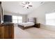 Vaulted Main bedroom with carpet, windows and wood-styled furniture at 6618 Latherton Ln, Charlotte, NC 28278