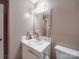Standard bathroom with white fixtures, including a toilet and single-sink vanity at 6820 Elm Forest Dr, Charlotte, NC 28212