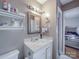 Bathroom features a vanity, a sink, and a mirror with modern lighting at 6820 Elm Forest Dr, Charlotte, NC 28212