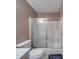 Bathroom featuring a combined shower and tub with a sliding glass door at 6820 Elm Forest Dr, Charlotte, NC 28212