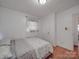 A bright bedroom with light walls and light-colored floors at 6820 Elm Forest Dr, Charlotte, NC 28212