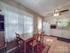 Open floor plan showing the dining room area and a view into the kitchen at 6820 Elm Forest Dr, Charlotte, NC 28212