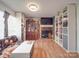 Stylish living room with a brick fireplace, custom shelving, and modern decor at 6820 Elm Forest Dr, Charlotte, NC 28212