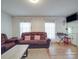 Cozy living space with hardwood floors, a plush sofa, and lots of natural light at 6820 Elm Forest Dr, Charlotte, NC 28212