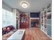 Stylish living room with a brick fireplace, custom shelving, and modern decor at 6820 Elm Forest Dr, Charlotte, NC 28212