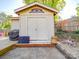 Shot of the backyard shed featuring painted siding, doors, and concrete base, with fence visible in the background at 6820 Elm Forest Dr, Charlotte, NC 28212
