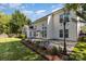 Spacious backyard featuring a large patio area, well-maintained lawn, and mature trees, perfect for outdoor enjoyment at 6941 Augustine Way, Charlotte, NC 28270
