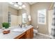 Neutral toned bathroom featuring a large vanity mirror at 6941 Augustine Way, Charlotte, NC 28270